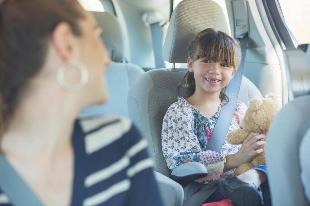 how old before a kid can sit in the front seat